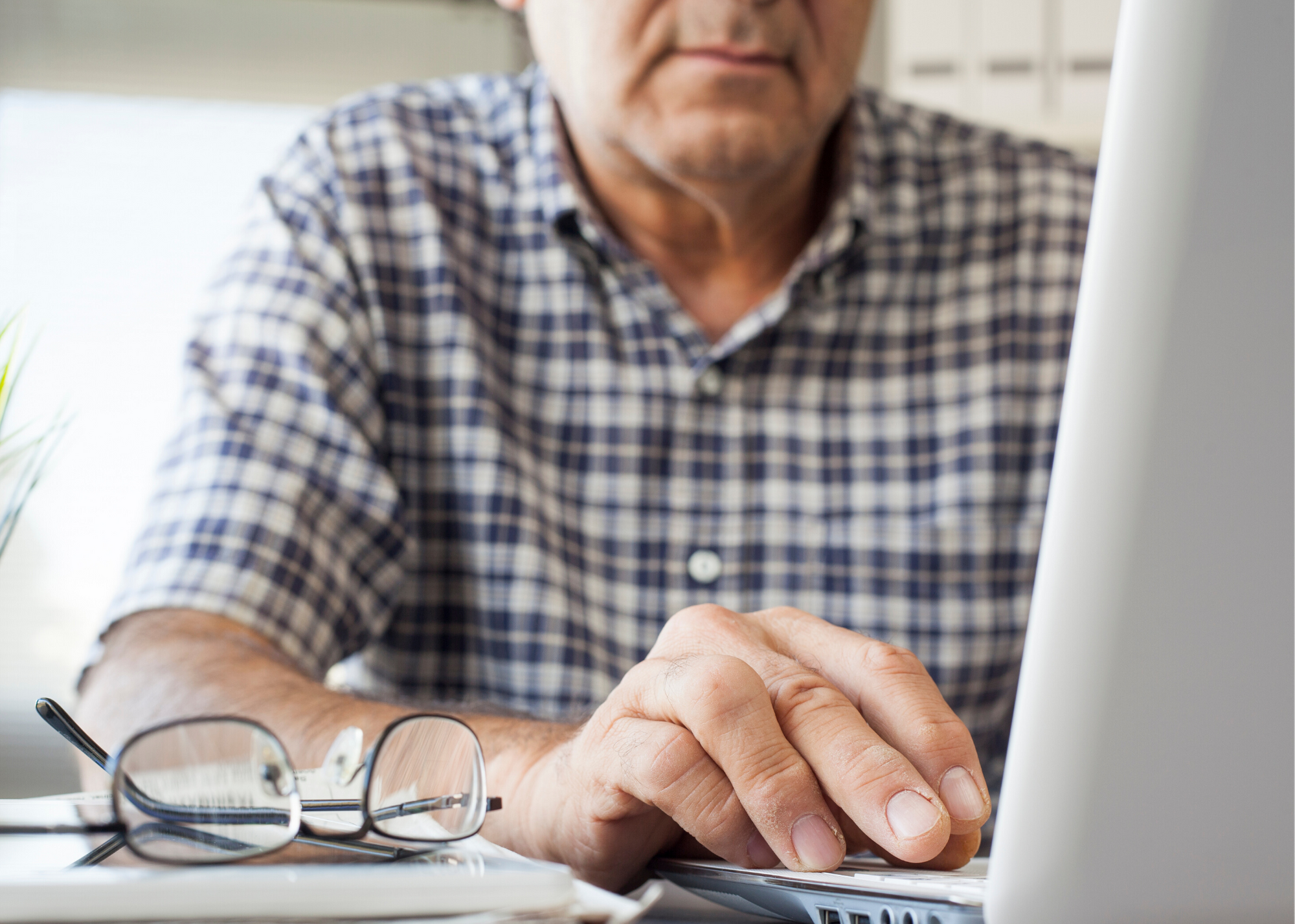 man typing on laptop, Minnesota mental health clinics, ccbhc Minnesota