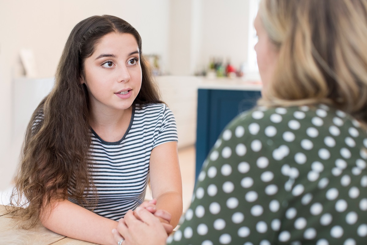 teen talking to parent